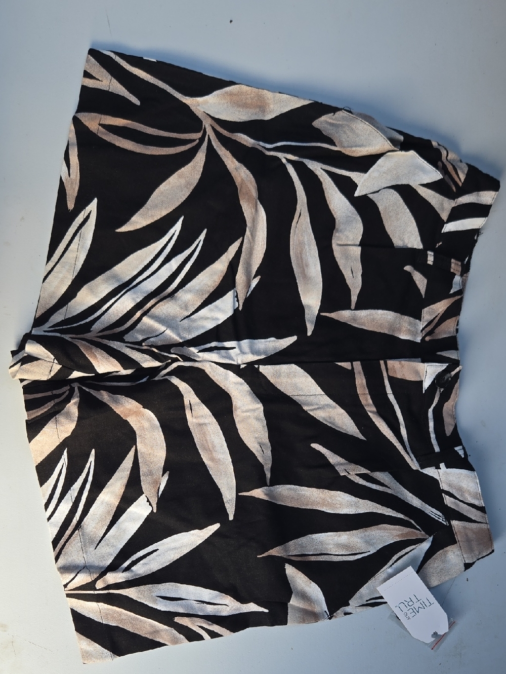 Black Leaf Print Shorts with Neutral Palm Pattern